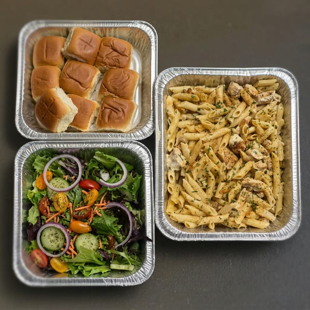 Half Pan Cajun Chicken Pasta with Salad and Bread Stick.